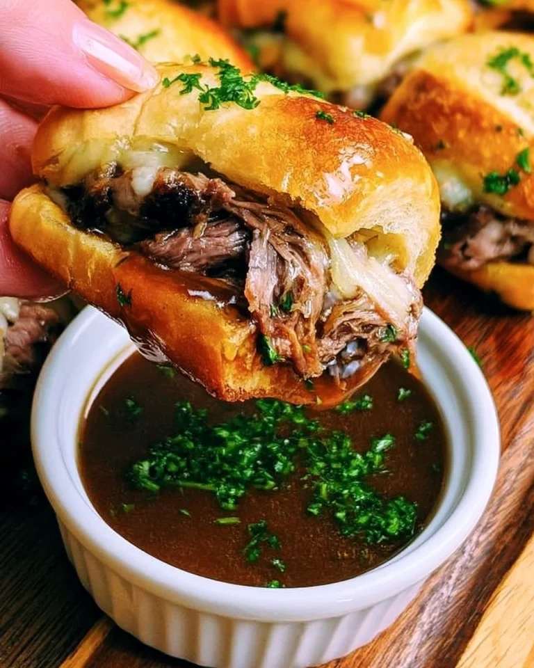 Delicious French Dip Sliders served with au jus for dipping
