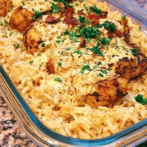 High protein creamy Cajun chicken served with rice in a bowl