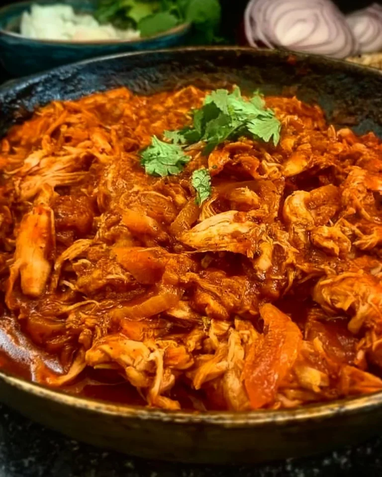 Delicious Minute Chicken Tinga served in a taco with toppings