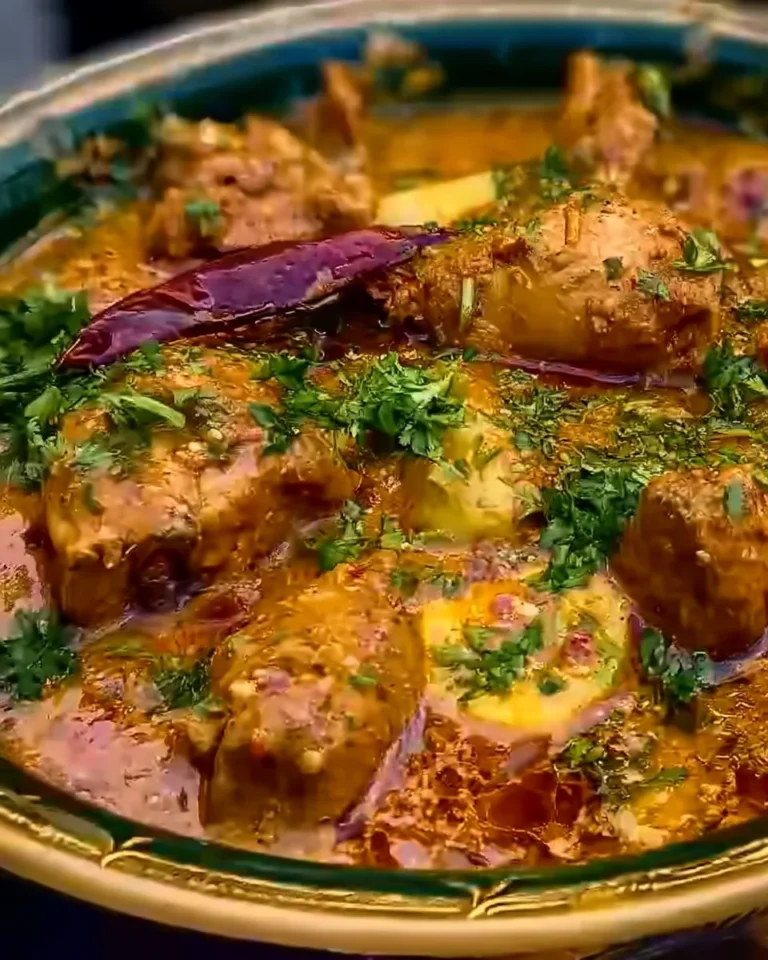 Delicious Nawabi Chicken Korma served in a bowl with garnishes