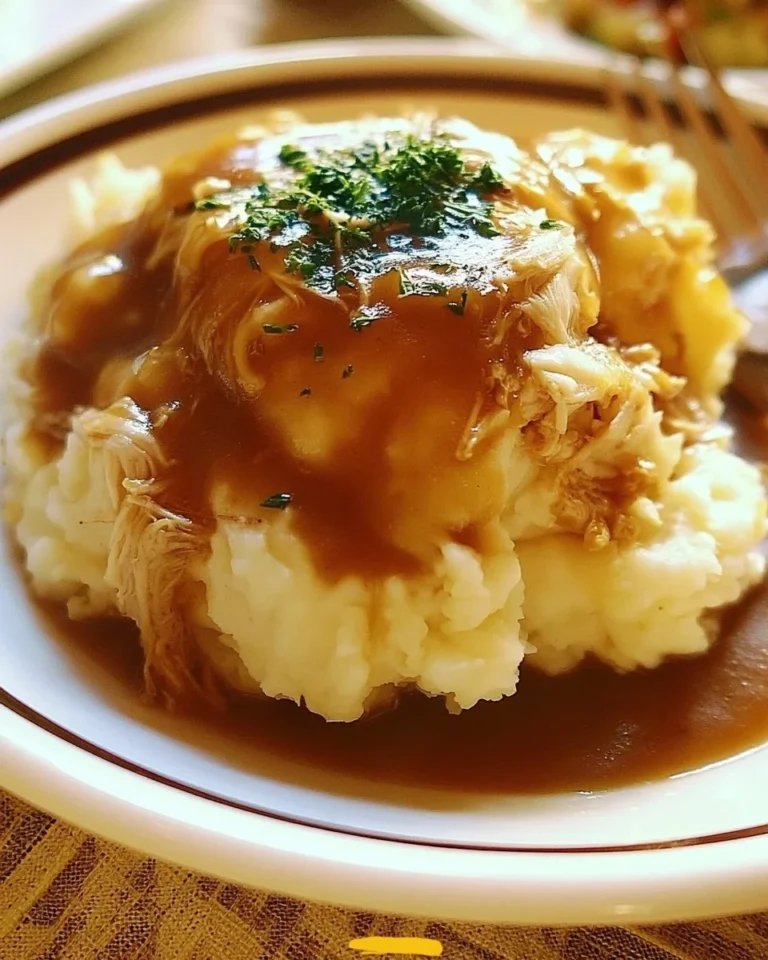 Delicious shredded chicken gravy served on creamy mashed potatoes