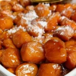 Delicious candied yams with brown sugar and cinnamon served in a dish.