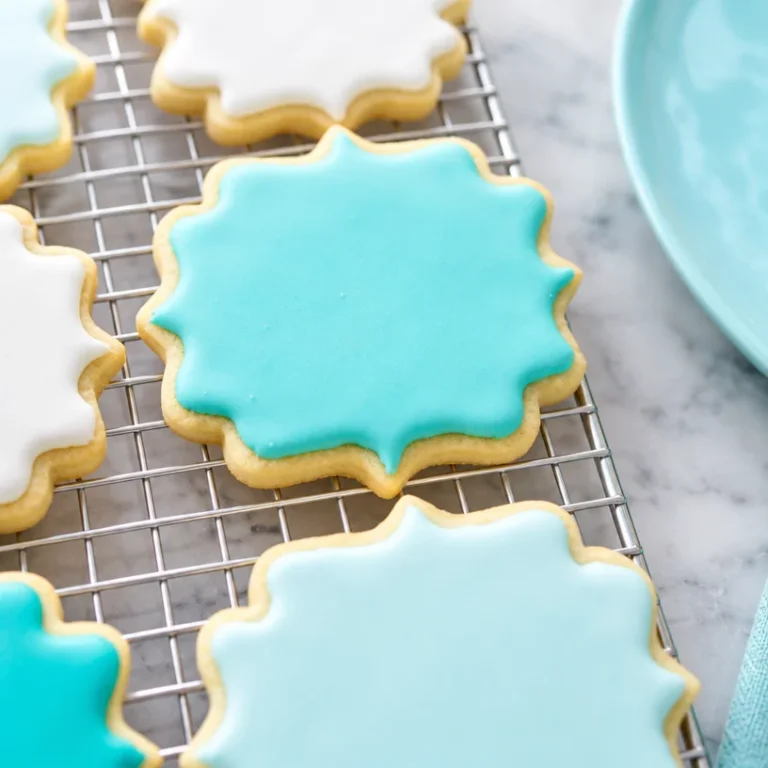 Bowl of easy royal icing made with simple ingredients for decorating cookies